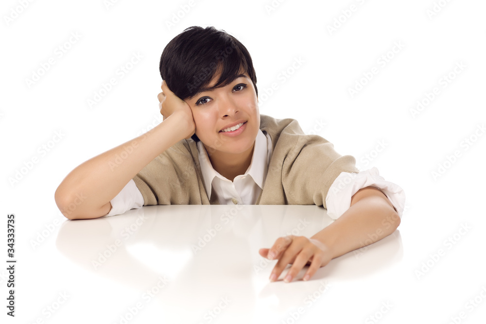 Smiling Mixed Race Young Adult Female Sitting at White Table Smiling Mixed Race Young Adult Female Sitting at White Table