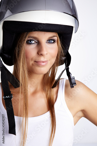 Sexy woman with a white motrcycle helmet and surprised expressio photo