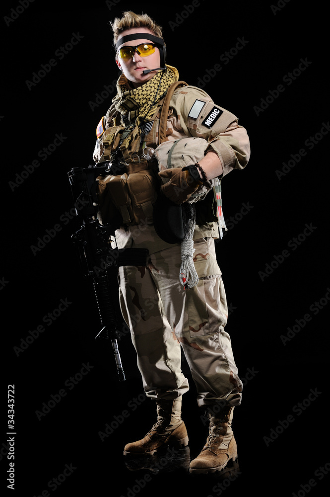 woman in military uniform with weapon