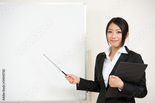 asian businesswoman with blank whiteboard