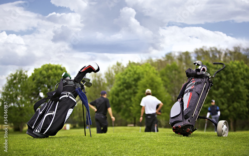 Golf bags with group of players