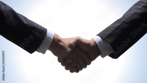 handshaking of businessmen