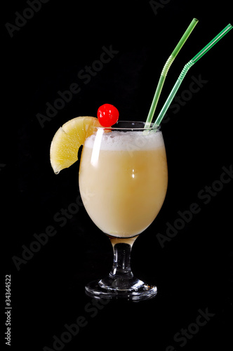 Pina colada drink cocktail glass with pineapple