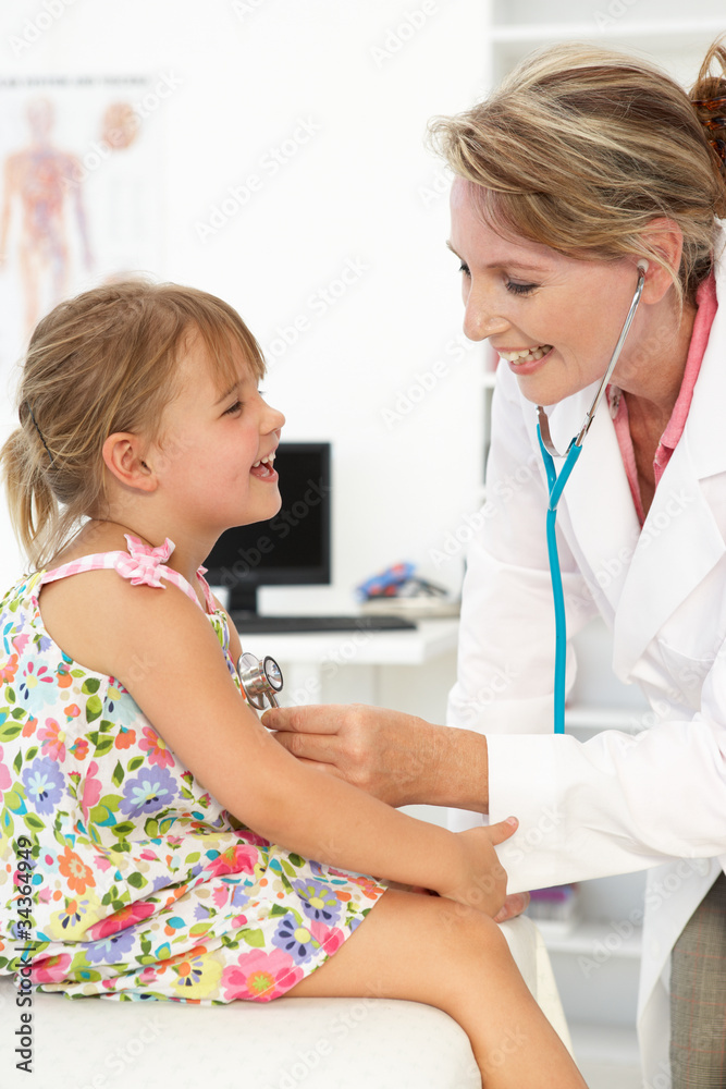 Female doctor examining child Female doctor examining child