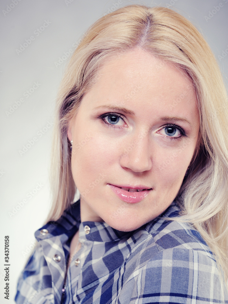Portrait of young pretty smiling woman in a shirt Portrait of young pretty smiling woman in a shirt