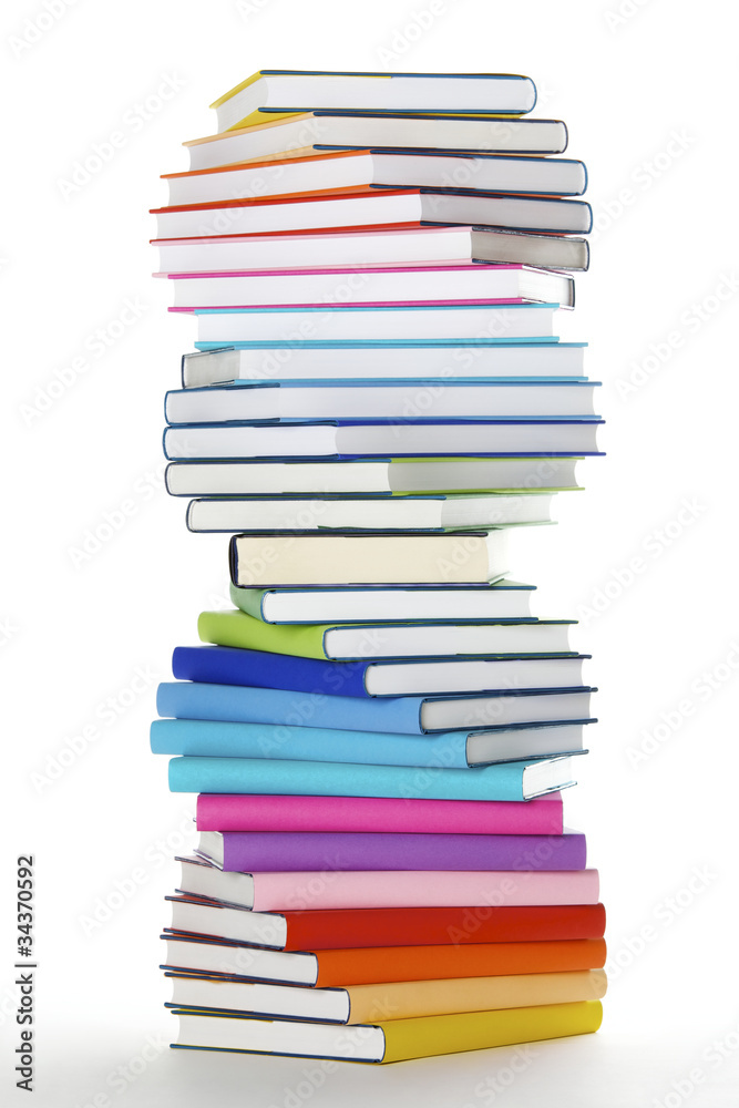 Spiral stack of rainbow colored books Spiral stack of rainbow colored books