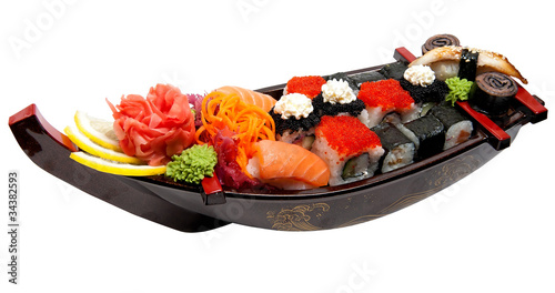 Set of sushi on wooden stand in the form of the boat