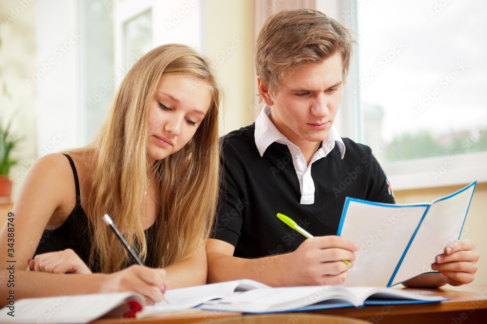 Portrait of a young group of students paying attention and doing Portrait of a young group of students paying attention and doing