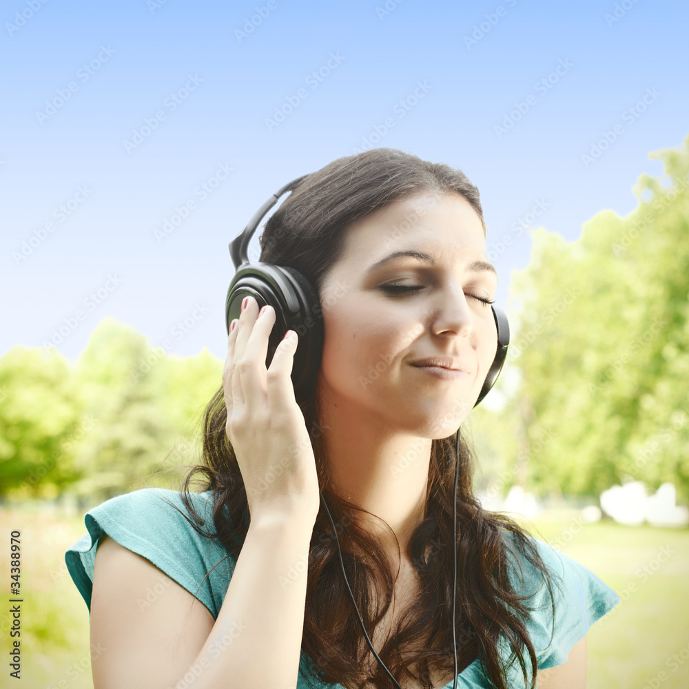 beauty young woman with headphones outdoors beauty young woman with headphones outdoors