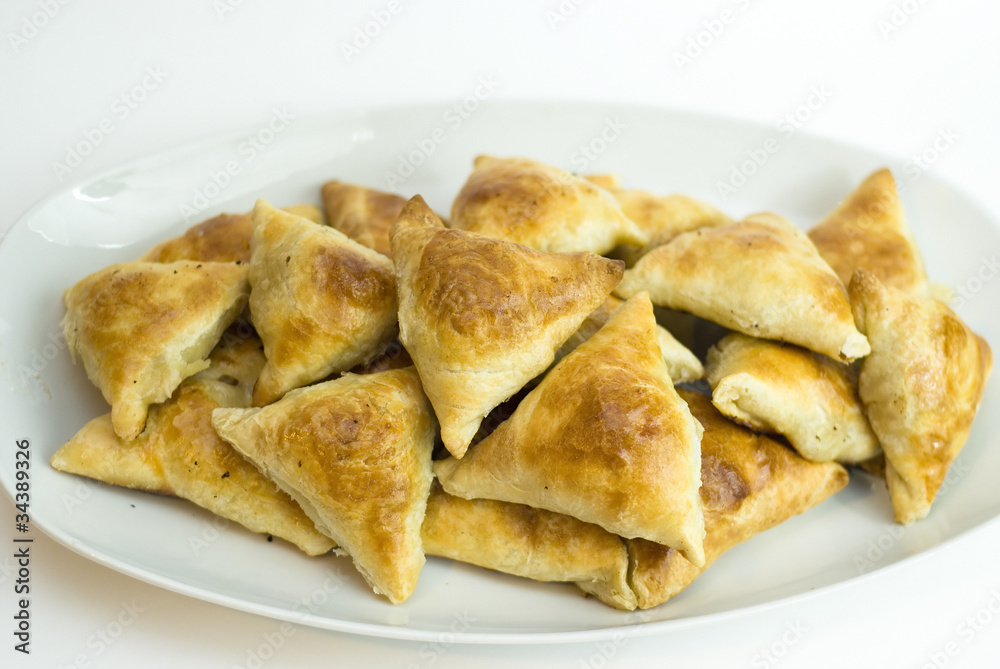 Midle Asian pies with meat, samsa on white background