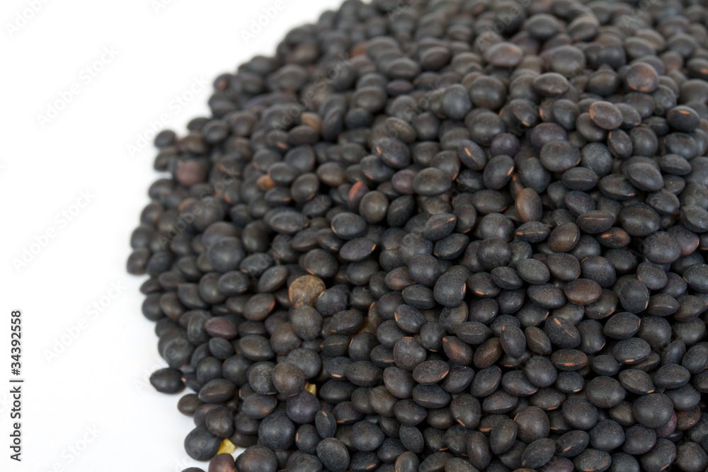 Heap of black lentil isolated on white Heap of black lentil isolated on white