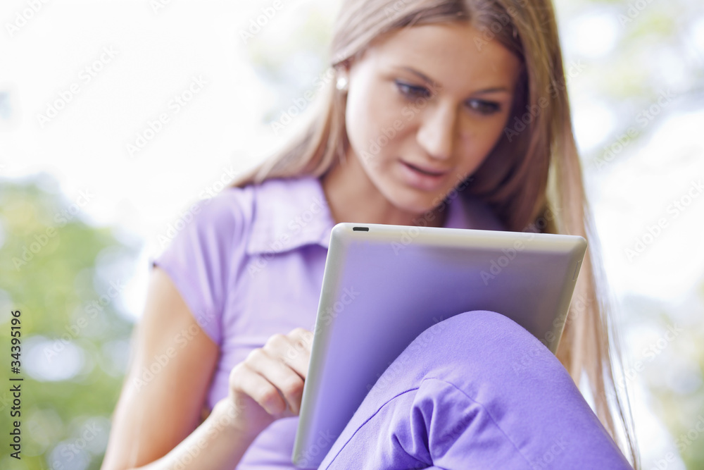Beautiful Woman With Tablet Computer In Park Beautiful Woman With Tablet Computer In Park