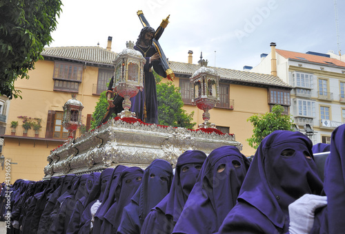Photos Costaleros bearing a Tronos during Semana Santa in Malaga, Spain