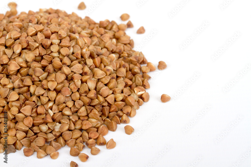 Isolated buckwheat on white background. Handful of grain Isolated buckwheat on white background. Handful of grain
