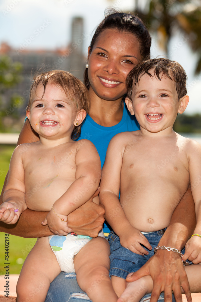 Cute babies with pretty young hispanic woman Cute babies with pretty young hispanic woman