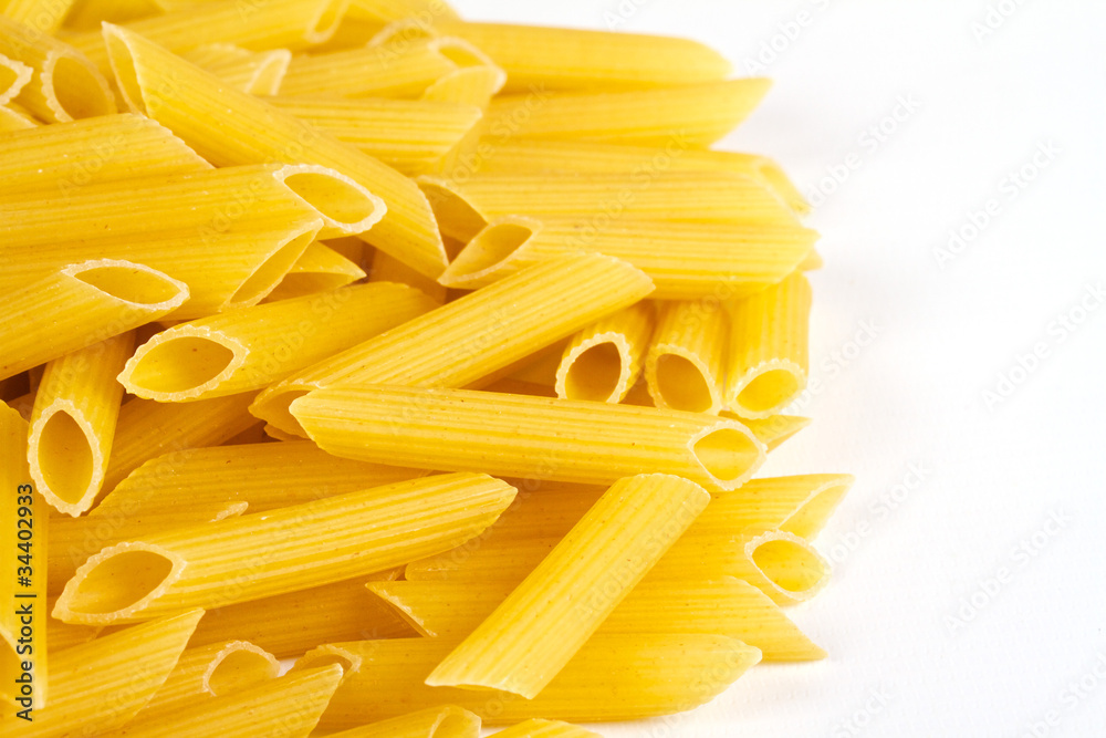 close up of a dried italian pasta on white background close up of a dried italian pasta on white background
