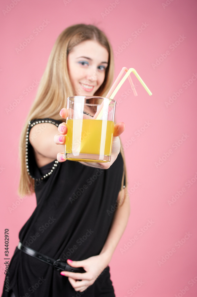 Beautiful girl offering orange juice or cocktail Beautiful girl offering orange juice or cocktail