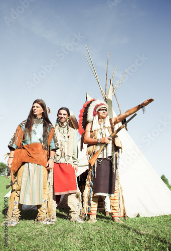 Group of North American Indians about a wigwam