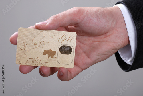 credit card in male hand photo