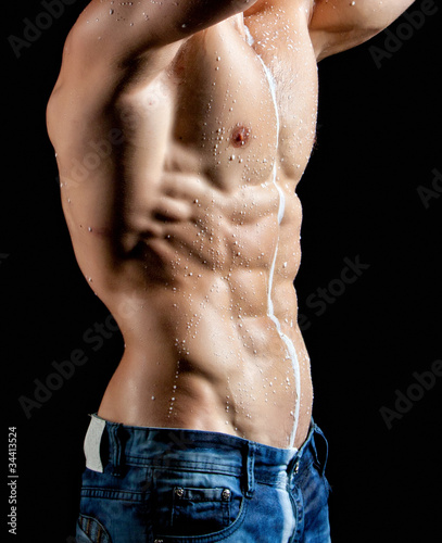 Muscle sexy young man torso perfused milk photo