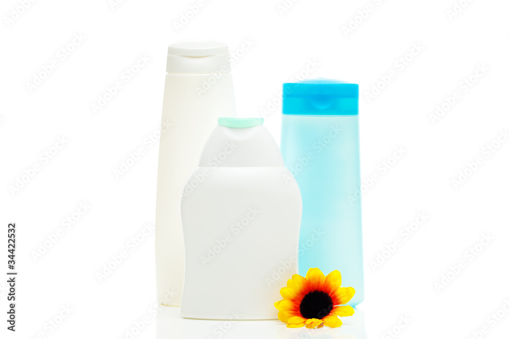 cosmetic containers and flower isolated on white cosmetic containers and flower isolated on white