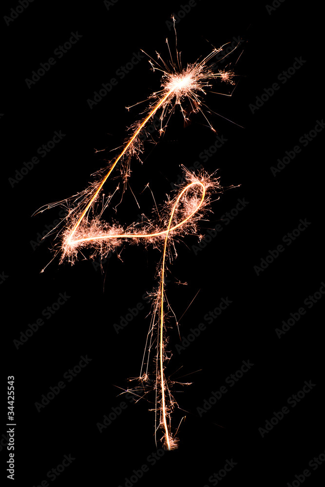Digit 4 made of sparklers isolated on black