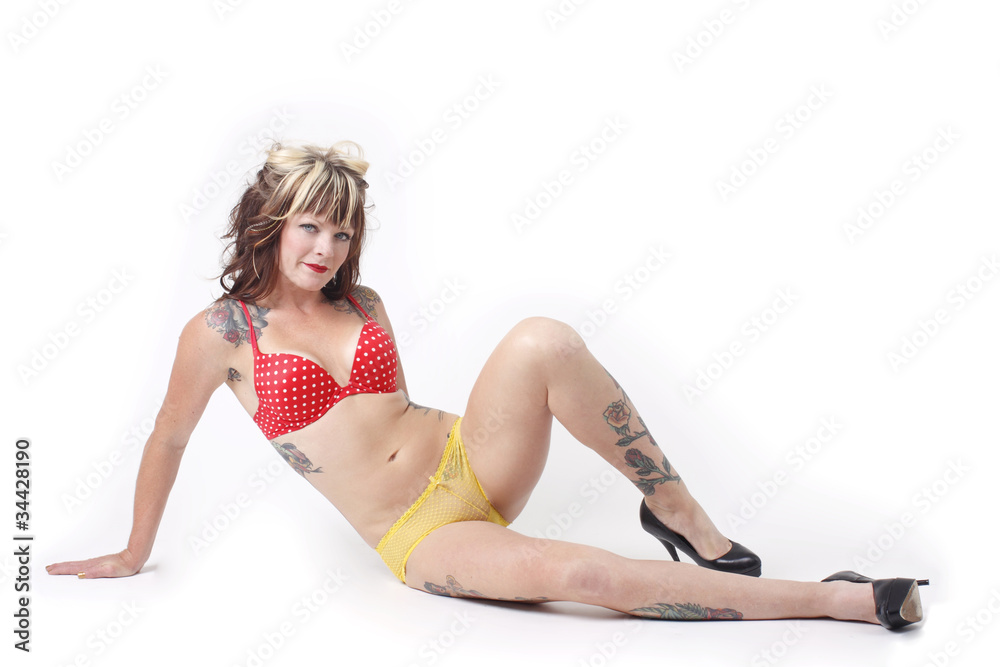 Obraz premium Sexy woman wearing yellow and red lingerie