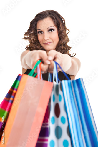 portrait young adult girl with colored bags