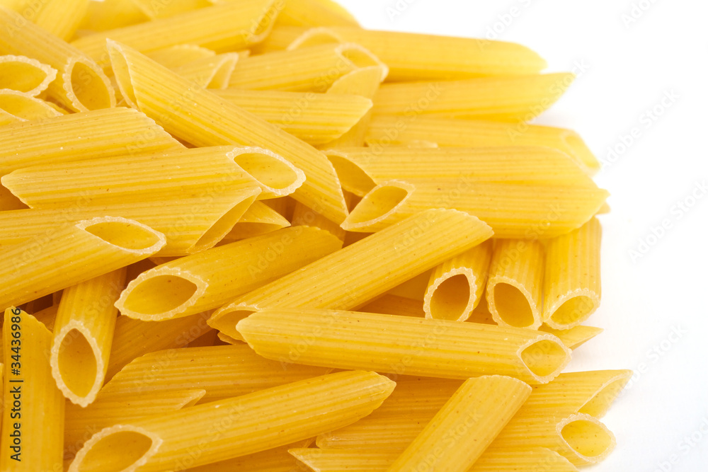 close up of a dried italian pasta on white background close up of a dried italian pasta on white background