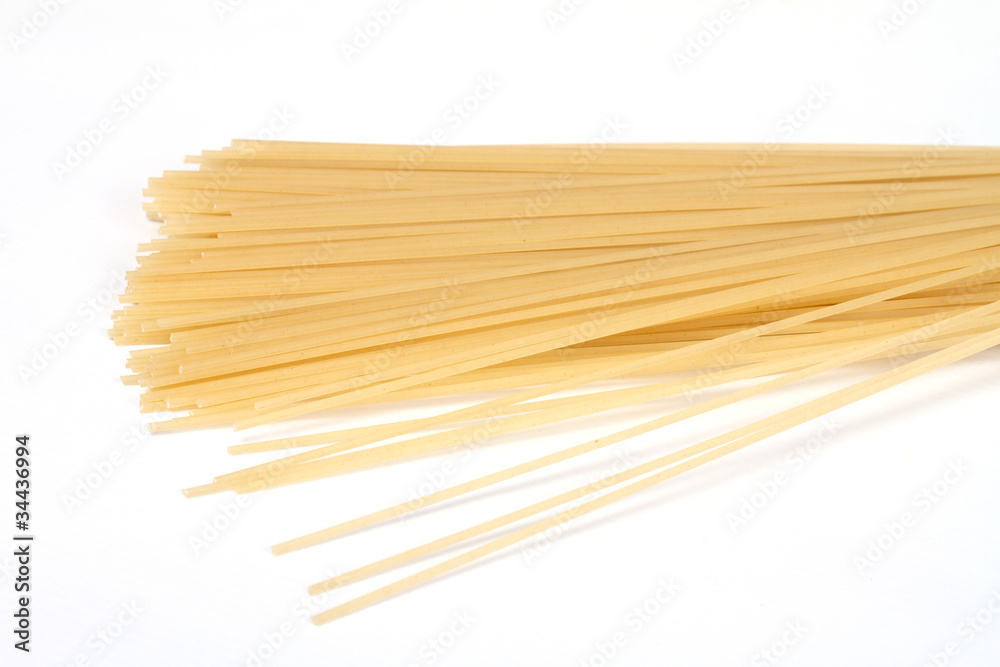 uncooked spaghetti noodles isolated on white background uncooked spaghetti noodles isolated on white background