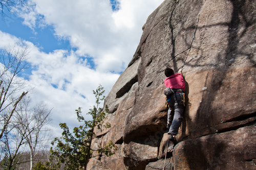 Young man climbing a crack in Quebec