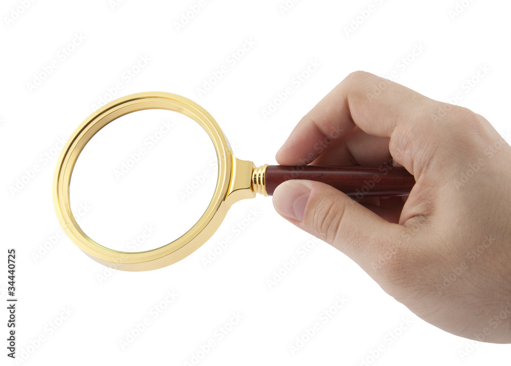 Magnifying glass in hand with clipping path Magnifying glass in hand with clipping path