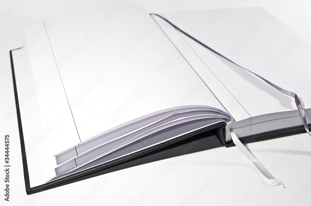 Aufgeschlagenes Buch mit Lesebändchen Aufgeschlagenes Buch mit Lesebändchen