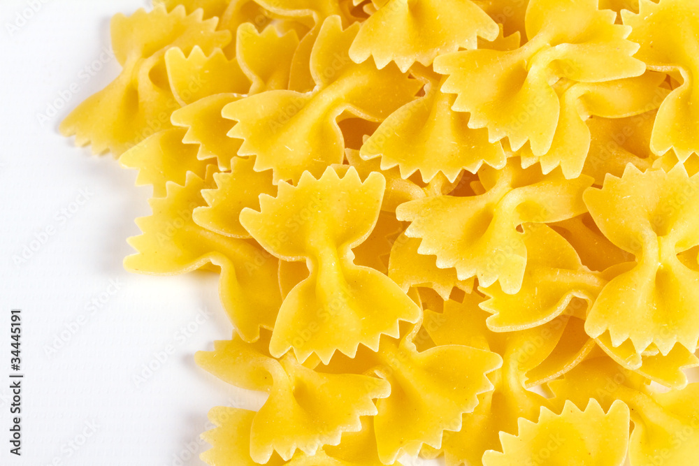 close up of a dried italian pasta on white background close up of a dried italian pasta on white background