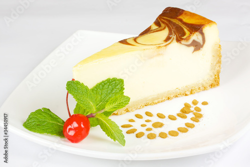 Gourmet slice of cheesecake on the white background photo