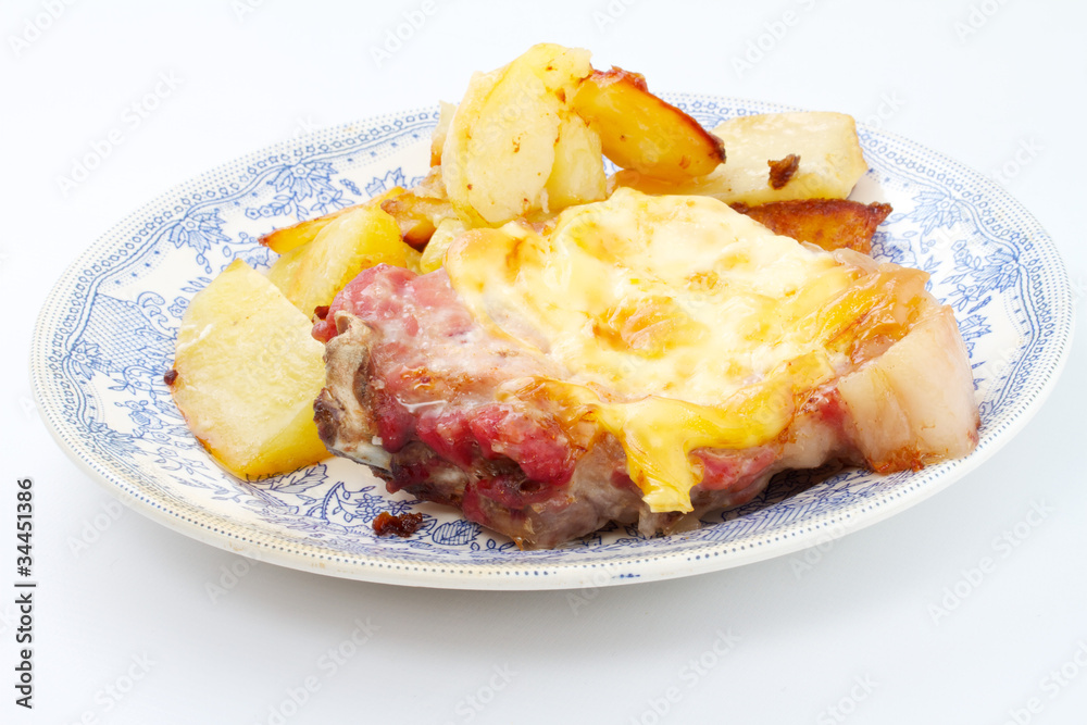 Grilled steak meat with cheese sauce and potatoes Grilled steak meat with cheese sauce and potatoes