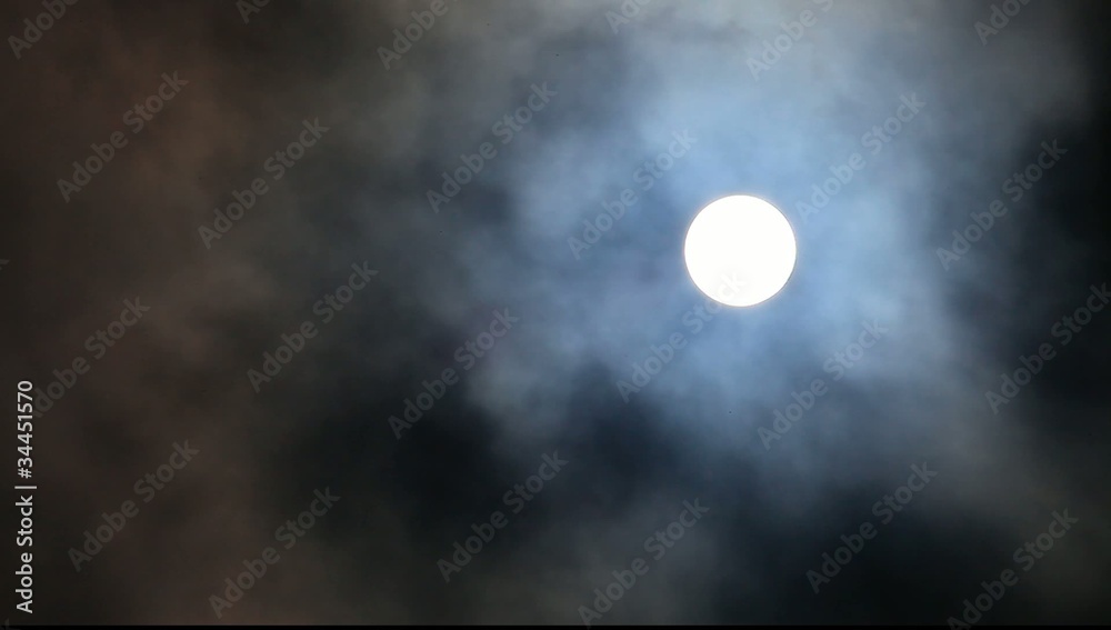 Full moon moving in and out clouds Full moon moving in and out clouds