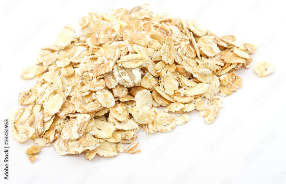 Heap of dry rolled oats isolated Heap of dry rolled oats isolated