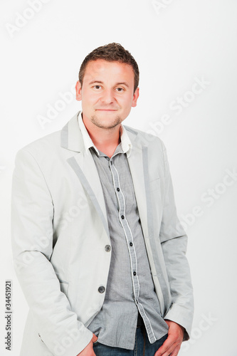 Portrait of happy smiling young business man