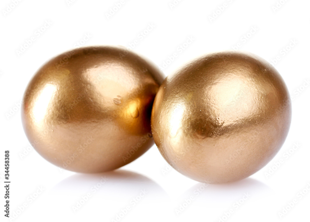 Fototapeta premium golden eggs isolated on white