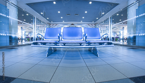 contemporary blue lounge with seats in the airport © Vladitto