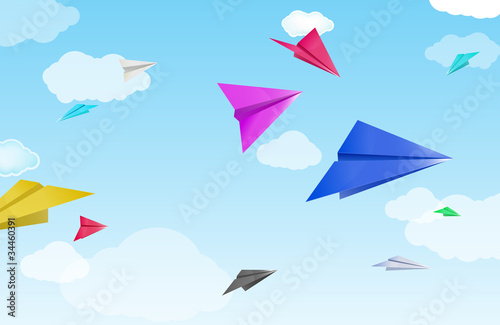 colorful paper planes on sky and cloud background