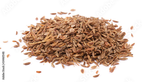 pile dill seeds on white background