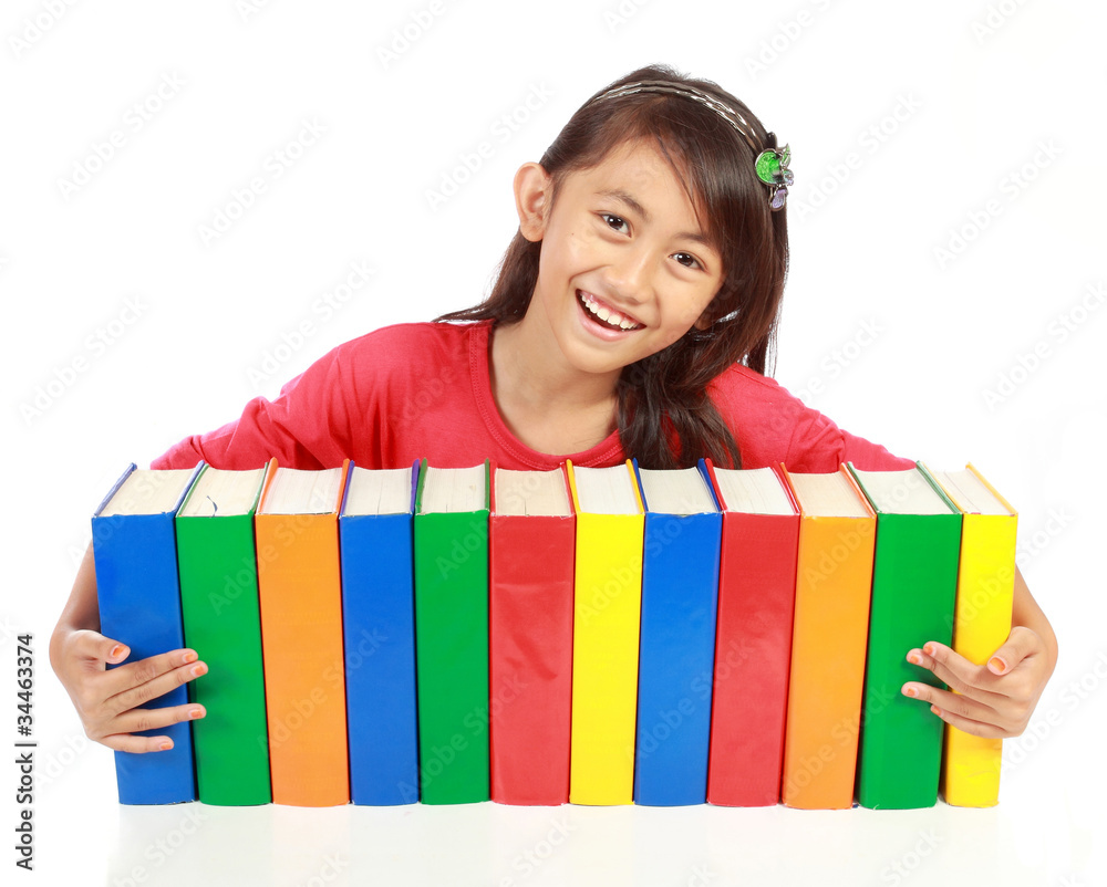 portrait of schoolgirl smiling with her books on his arms agains portrait of schoolgirl smiling with her books on his arms agains