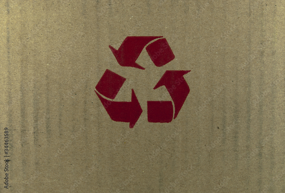 Red recycle symbol on cardboard. Stock Photo | Adobe Stock