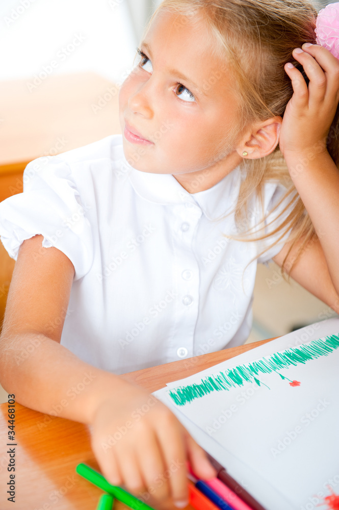 Little girl looking for a drawing concept wile painting picture Little girl looking for a drawing concept wile painting picture
