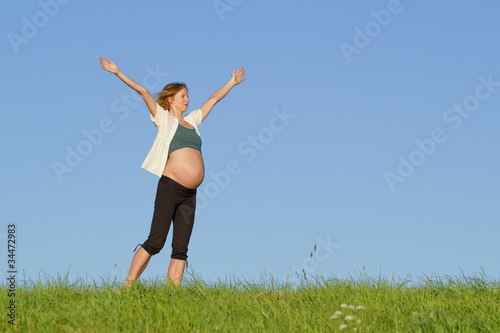 pregnant woman on meadow