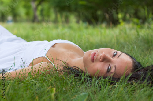 portrait of a girl lying on grass