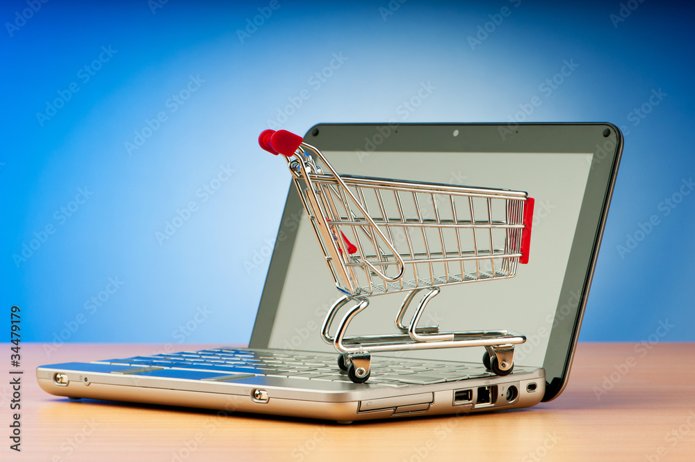 Internet online shopping concept with computer and cart Internet online shopping concept with computer and cart
