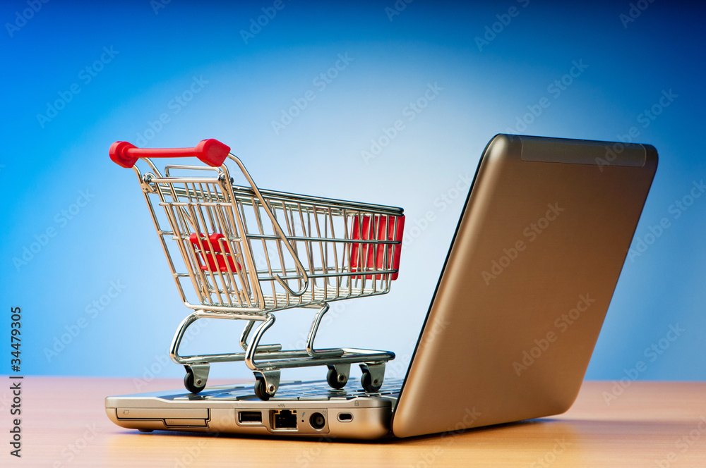 Internet online shopping concept with computer and cart